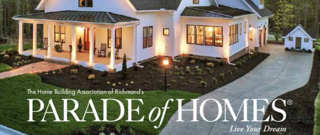 Parade of Homes text over a bright white home at dusk